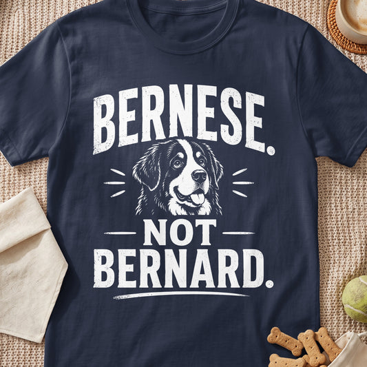 Navy blue t-shirt featuring white text that reads Bernese not Bernard above and below a Bernese Mountain Dog graphic.