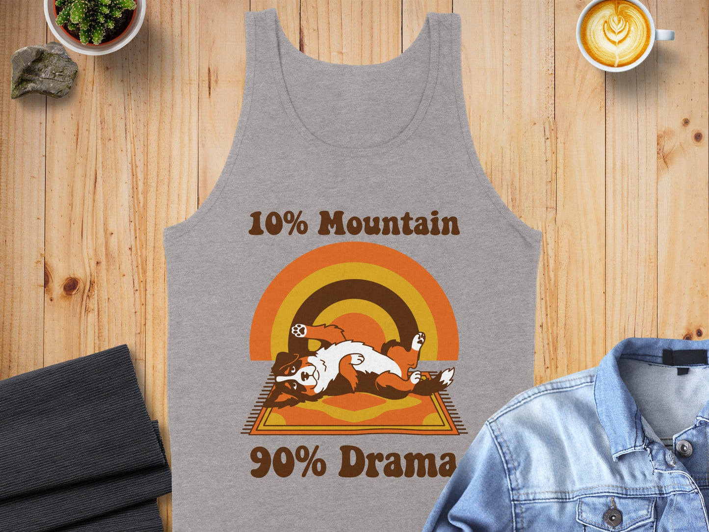 Grey tank top with a distressed graphic of a dog on a rug with the text "10% Mountain 90% Drama."