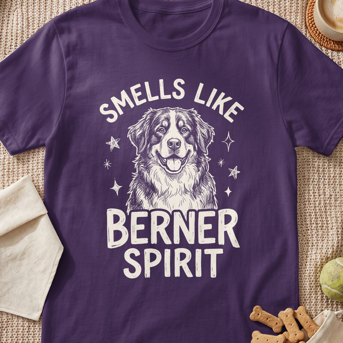 Purple t-shirt with a drawing of a Bernese Mountain Dog and text "SMELLS LIKE BERNER SPIRIT".