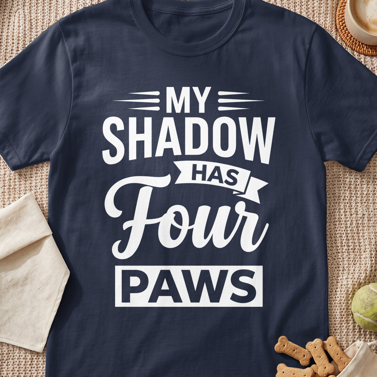 Navy t-shirt with white text "MY SHADOW HAS FOUR PAWS"