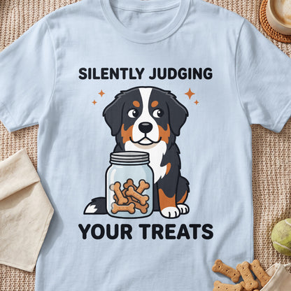 Bernese Mountain Dog and jar of bone treats with text "Silently Judging Your Treats".
