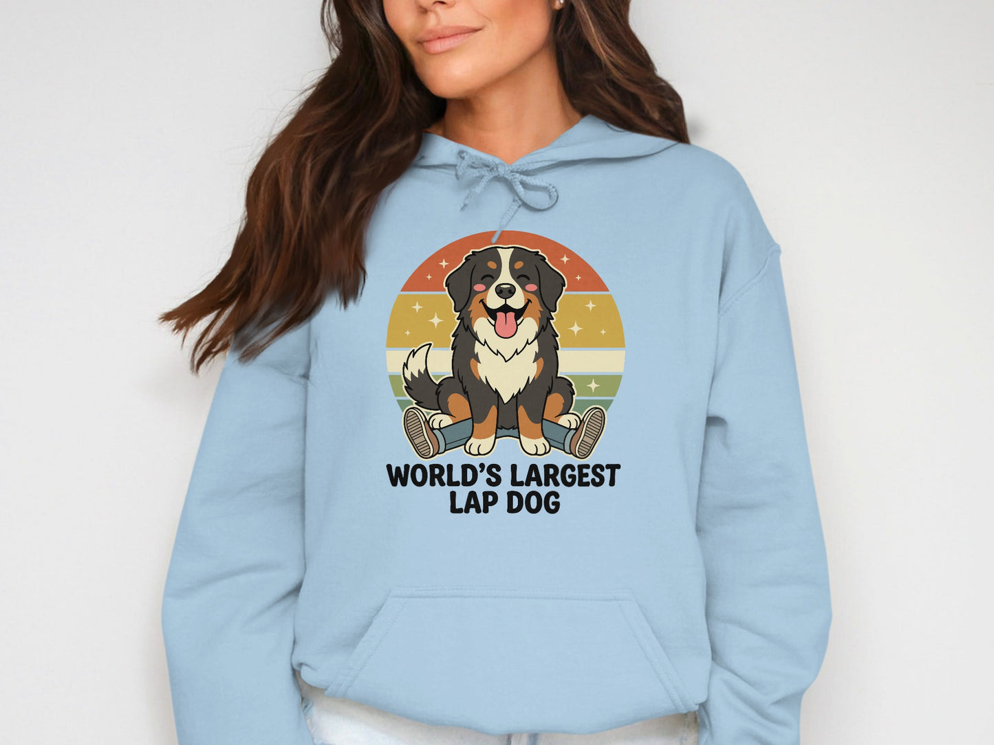 Light blue hoodie with cartoon Bernese Mountain Dog and text "WORLD'S LARGEST LAP DOG."