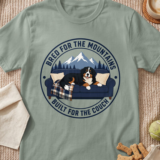 Bernese Mountain Dog on couch with mountains and trees graphic and text.