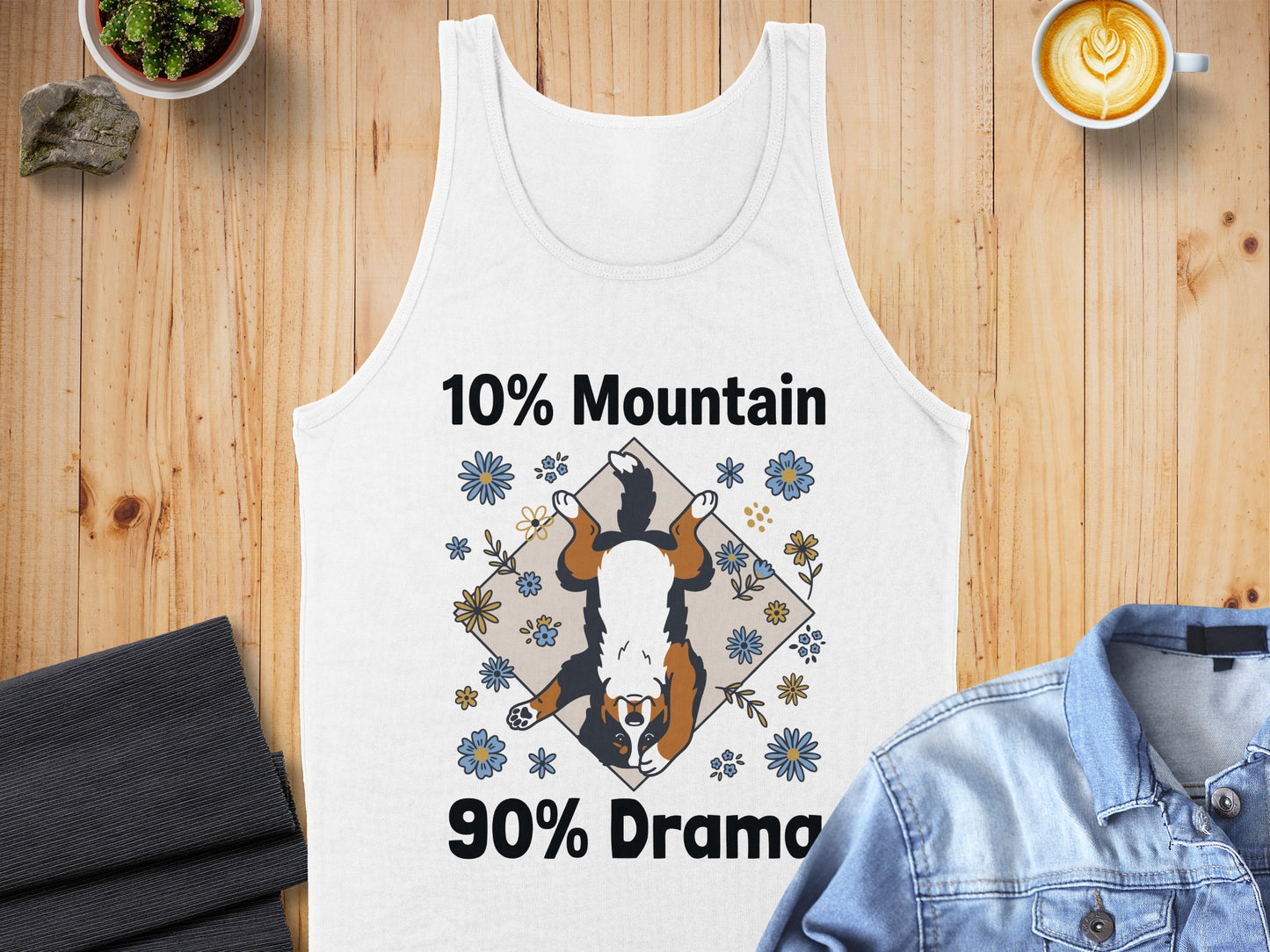 White tank top with a dog graphic and text "10% Mountain 90% Drama."