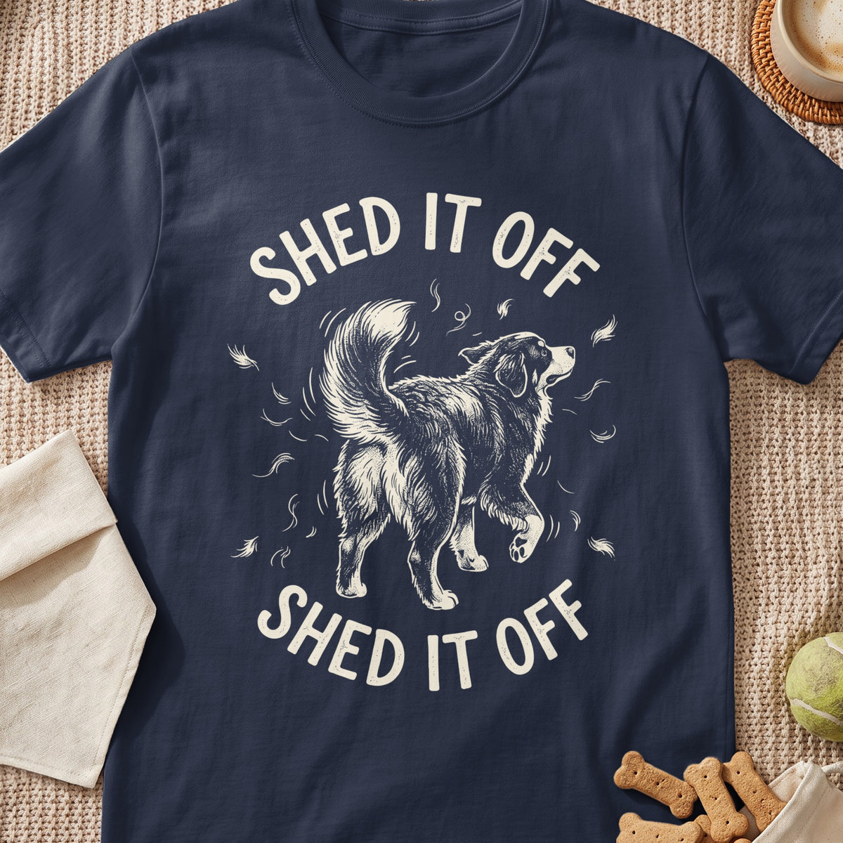 Navy t-shirt with a black and white drawing of a dog shedding and the text "SHED IT OFF".