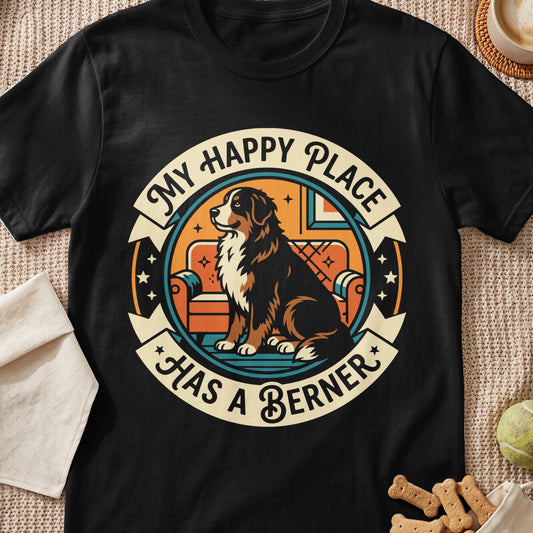Black t-shirt graphic with Bernese Mountain Dog on a couch, "My Happy Place Has a Berner."