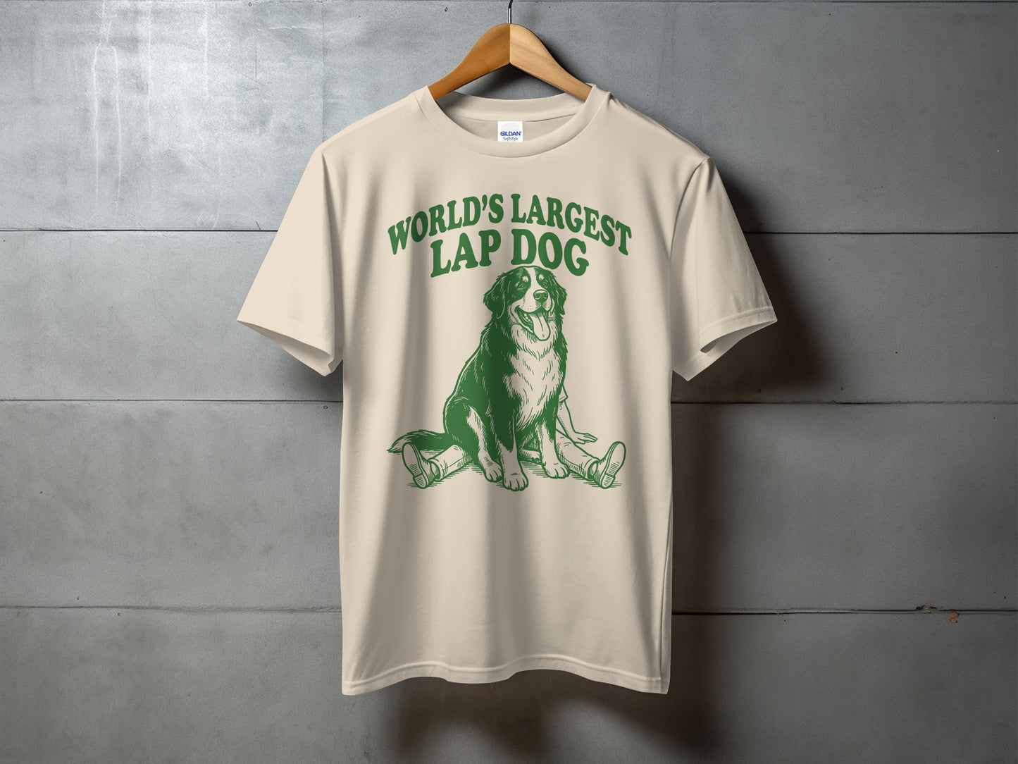 Cream t-shirt with green text "WORLD'S LARGEST LAP DOG" and dog graphic.