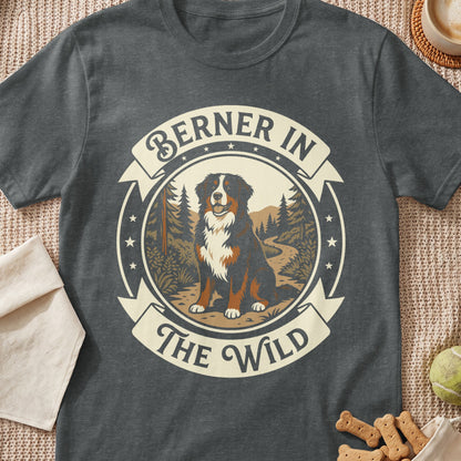 Bernese Mountain Dog with text "Berner In The Wild" in a scenic forest circle.