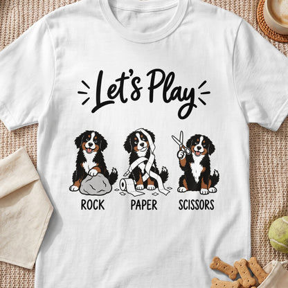 White t-shirt with "Let's Play" text and three Bernese Mountain Dogs representing Rock, Paper, Scissors.