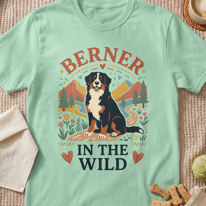 Bernese Mountain Dog graphic with text "BERNER IN THE WILD" on a light green t-shirt.