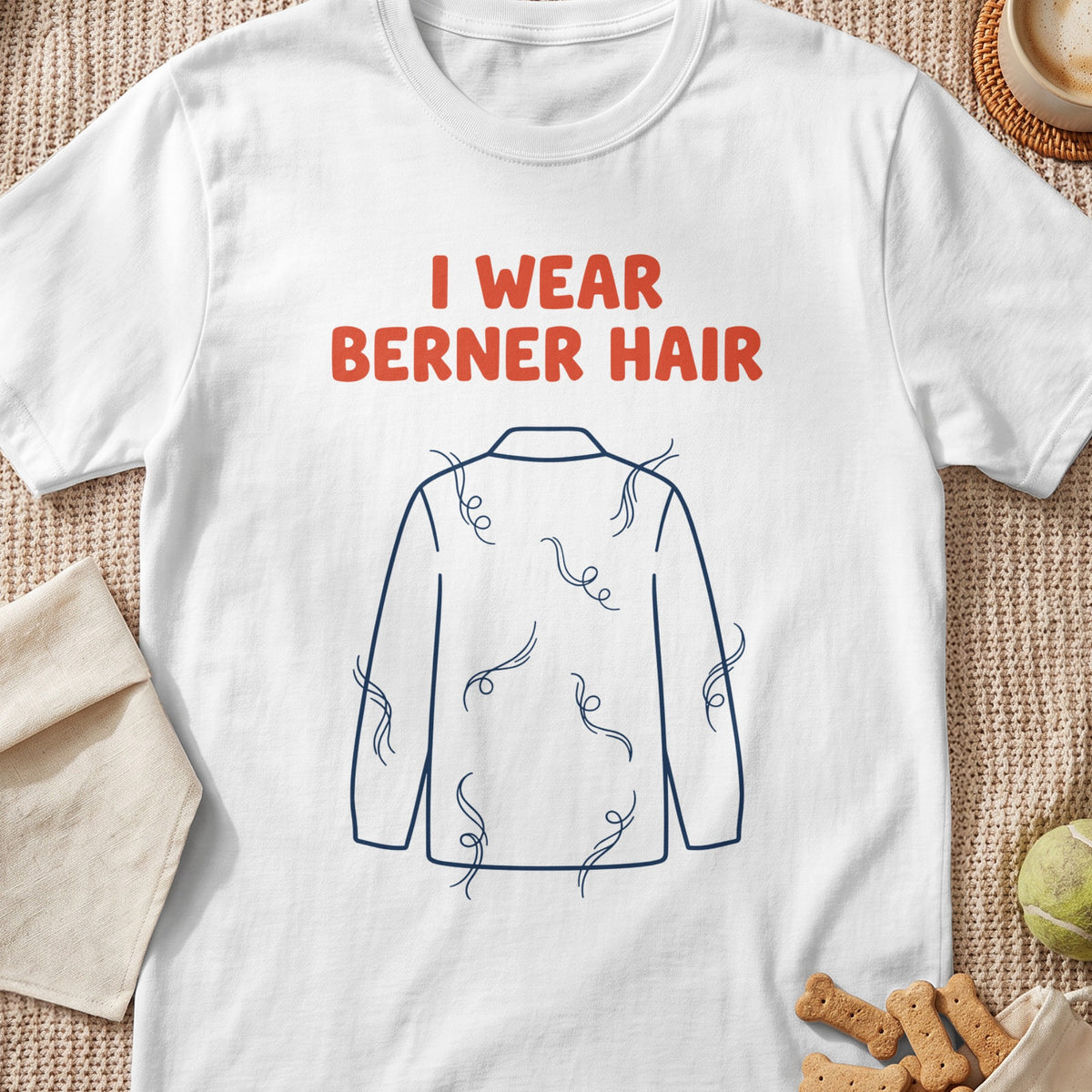 White t-shirt with text "I WEAR BERNER HAIR" and dog hair illustration.