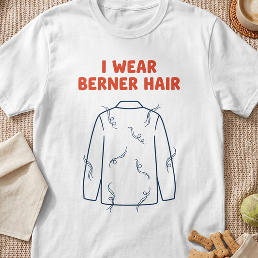 White t-shirt with text "I WEAR BERNER HAIR" and dog hair illustration.