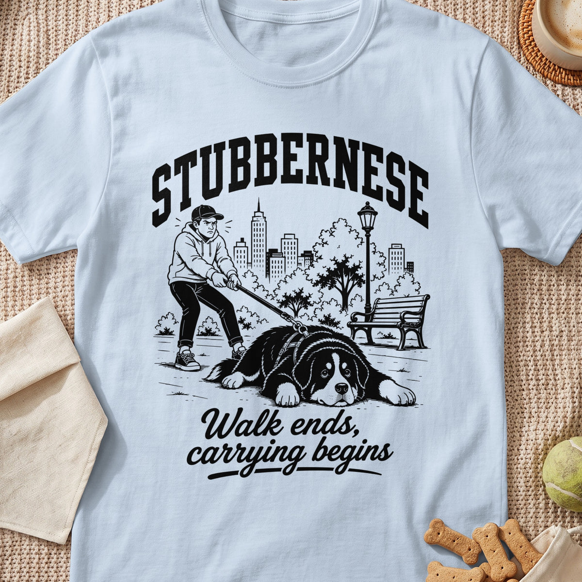 Light blue t-shirt with "Stubbernese" and "Walk ends, carrying begins" text and dog graphic.