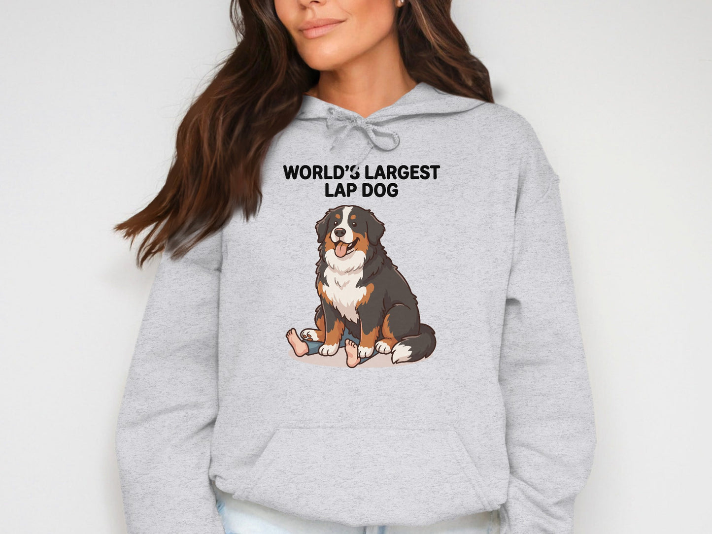 Grey hoodie with "WORLD'S LARGEST LAP DOG" text and Bernese Mountain Dog illustration.