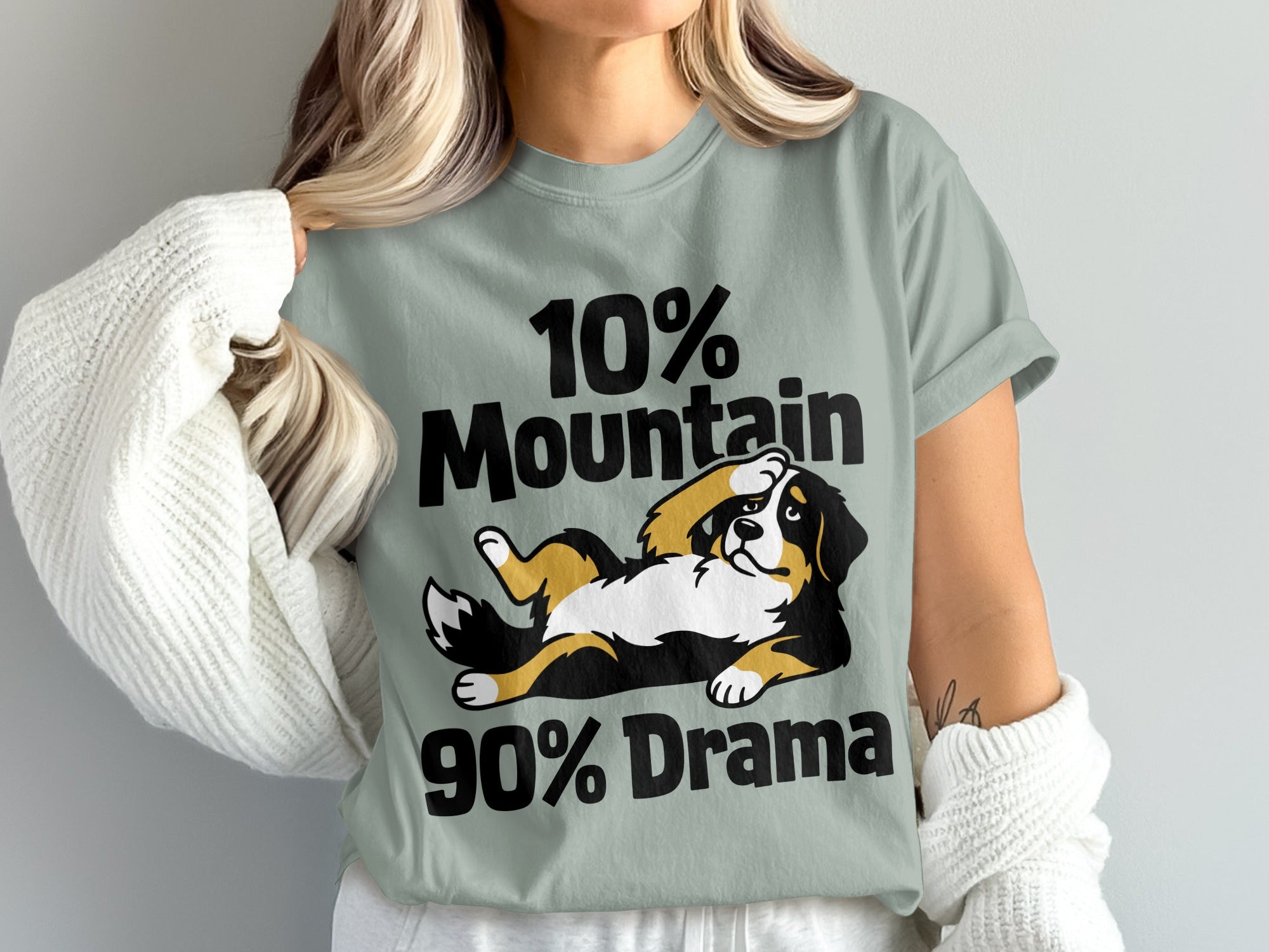 "10% Mountain 90% Drama" graphic with a Bernese Mountain Dog on a pale green t-shirt.