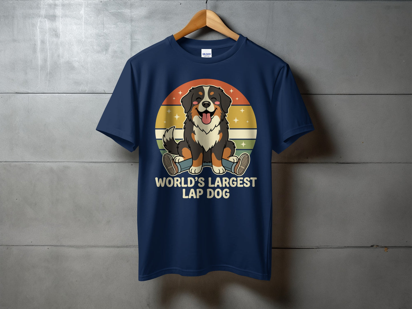 Navy t-shirt with a cartoon Bernese Mountain Dog sitting before a retro sunset graphic, with text "WORLD'S LARGEST LAP DOG".