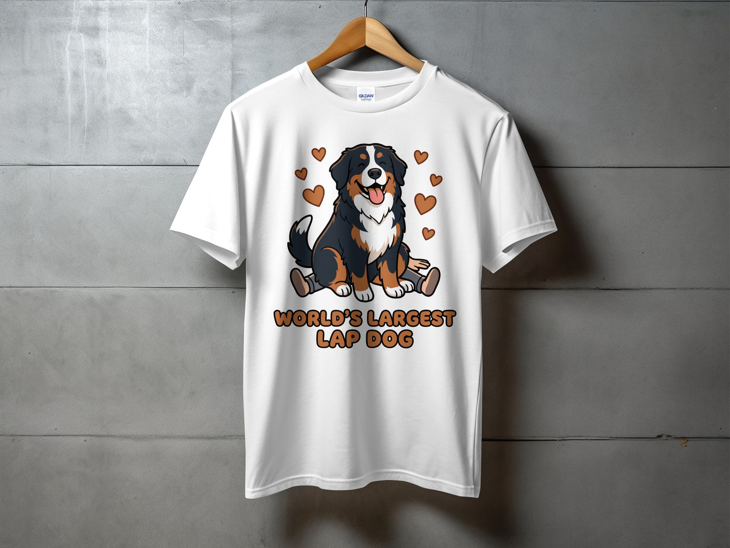 White t-shirt with a cartoon Bernese Mountain Dog and "WORLD'S LARGEST LAP DOG" text.