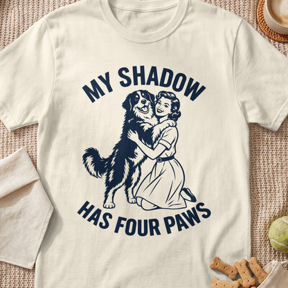 Woman hugging a dog with text "MY SHADOW HAS FOUR PAWS".