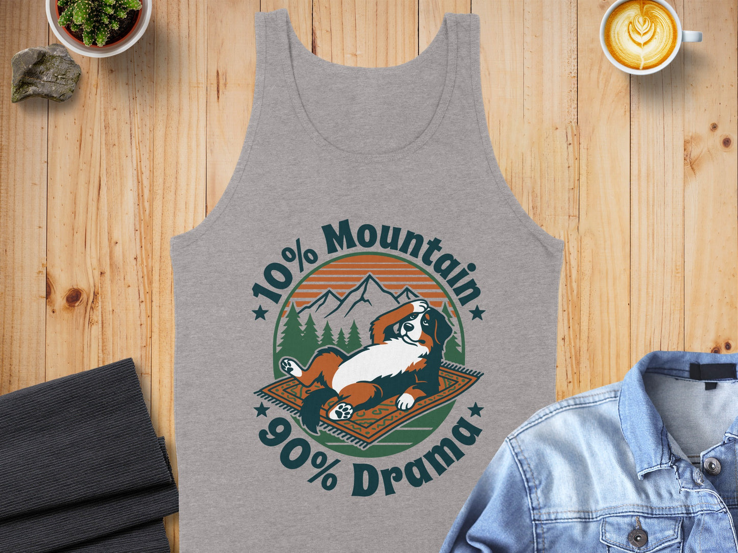 Grey tank top with a graphic of a Bernese Mountain Dog on a rug, "10% Mountain 90% Drama".