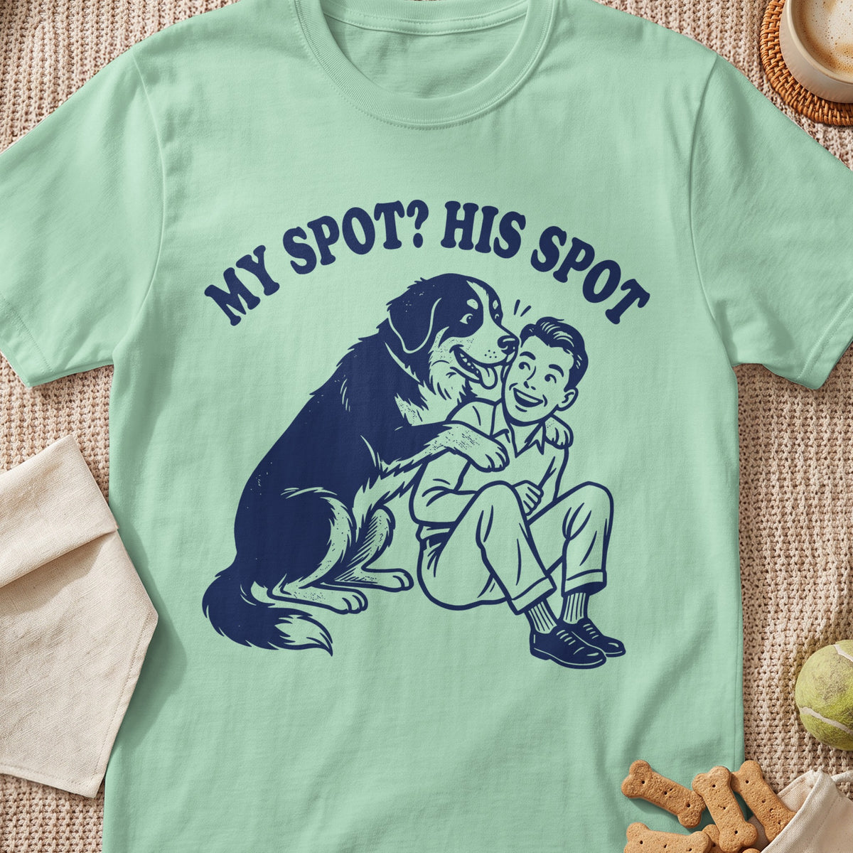 T-shirt with dark blue graphic of dog hugging man, text reads "MY SPOT? HIS SPOT".