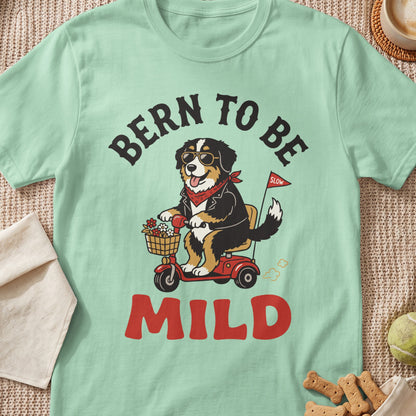 Bern to be mild, featuring a dog riding a scooter with flowers and a "slow" flag.