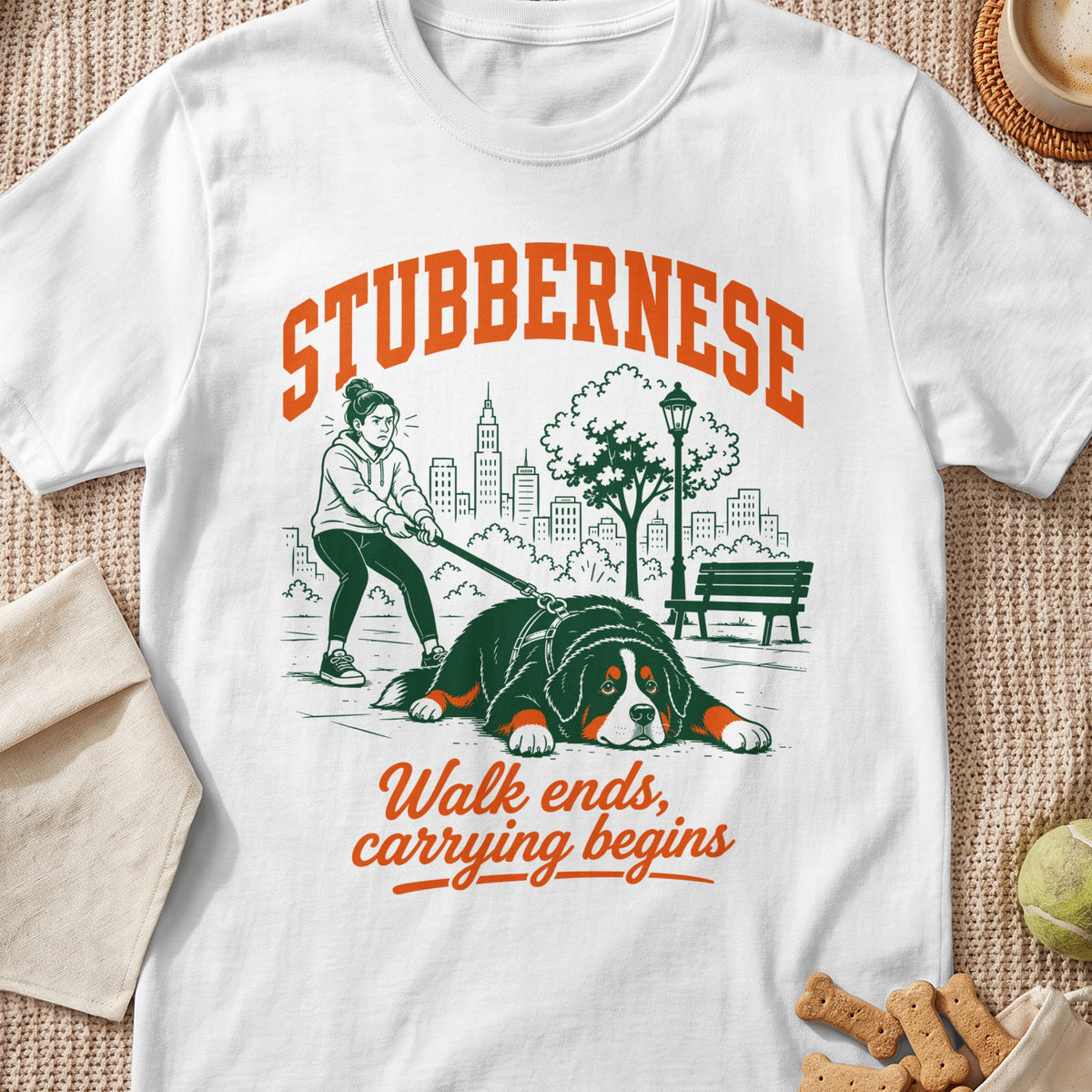 White t-shirt with "STUBBERNESE" and "Walk ends, carrying begins" text and dog illustration.