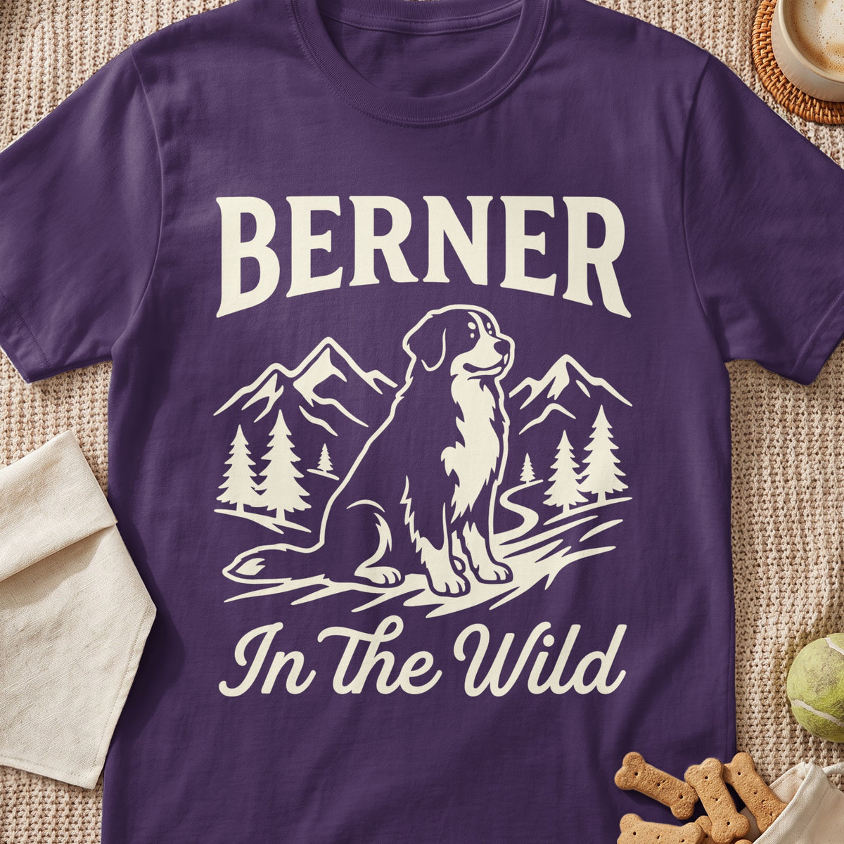 Purple t-shirt with cream text "BERNER In The Wild" and dog silhouette.