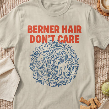 Cream t-shirt with text "BERNER HAIR DON'T CARE" and a stylized blue ball of fur.