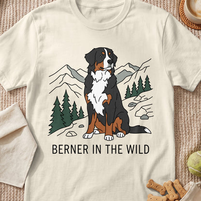 Bernese Mountain Dog in a mountain landscape with text "BERNER IN THE WILD".