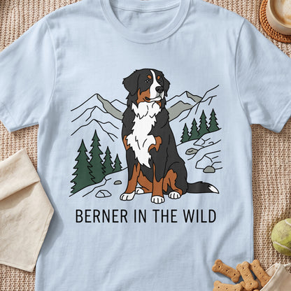 Light blue t-shirt with a Bernese Mountain Dog in a mountain landscape and text "BERNER IN THE WILD".