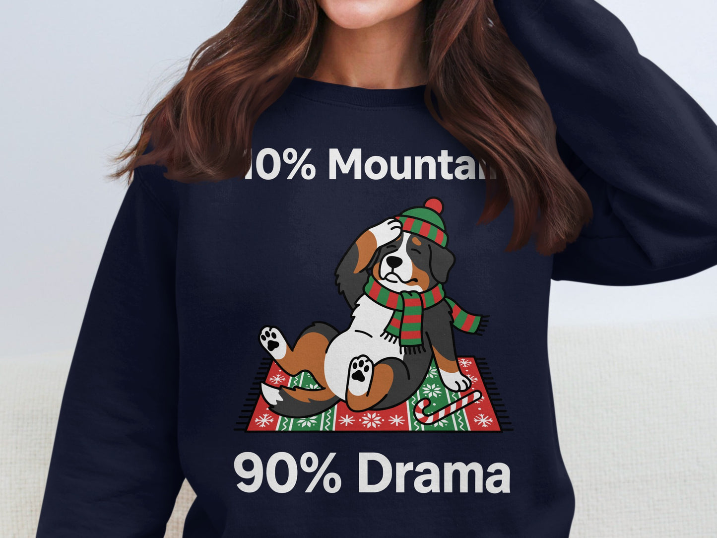 Bernese Mountain Dog wearing a hat and scarf with text "10% Mountain 90% Drama."