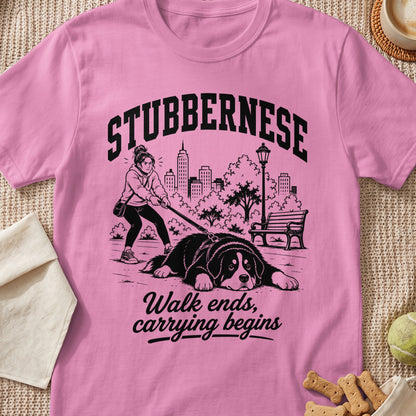 Pink t-shirt with "STUBBERNESE" text and graphic of dog refusing to walk.