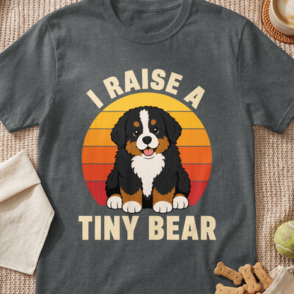 Dark grey t-shirt with a Bernese Mountain Dog puppy and text "I RAISE A TINY BEAR".