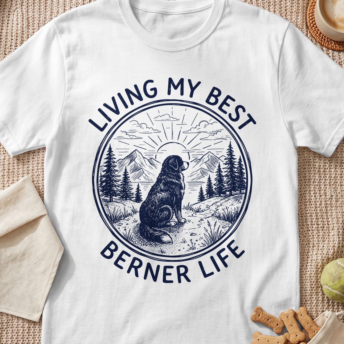Berner dog sitting in mountains with text "Living My Best Berner Life".
