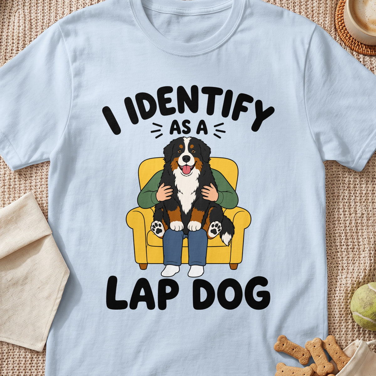 Bernese Mountain Dog sitting on a lap with text "I identify as a lap dog."