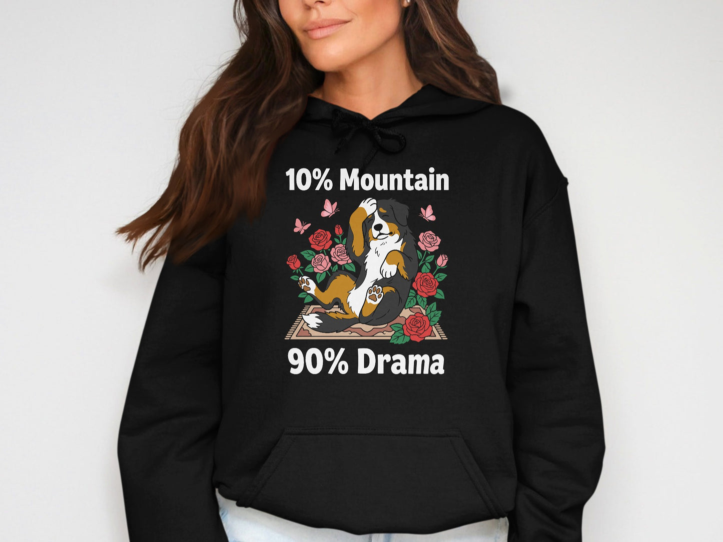 Black hoodie with graphic of dog, roses, and text "10% Mountain 90% Drama".