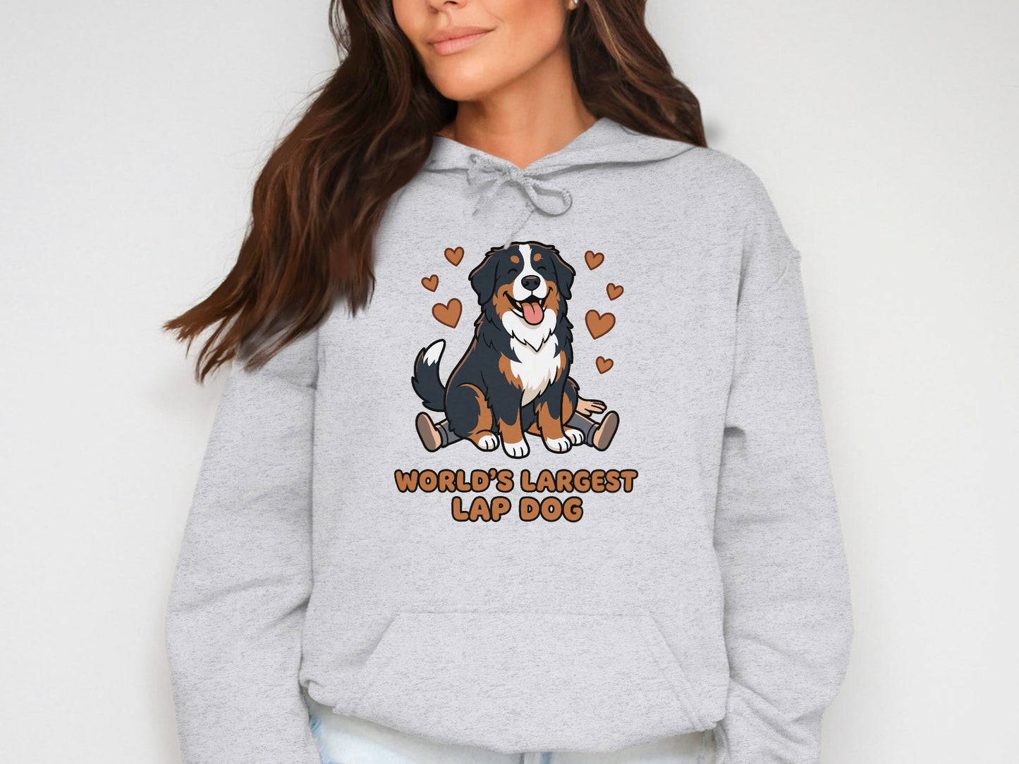 Gray hooded sweatshirt with cartoon Bernese Mountain Dog and "WORLD'S LARGEST LAP DOG" text.