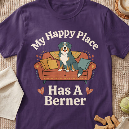 Purple t-shirt with illustration of dog on couch and text "My Happy Place Has A Berner".