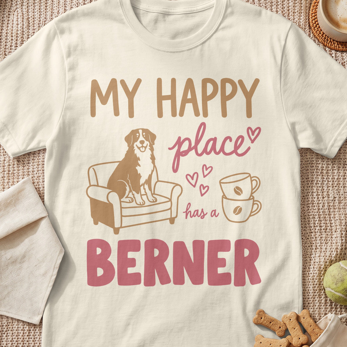 T-shirt graphic with text "MY HAPPY place has a BERNER" and dog on couch.