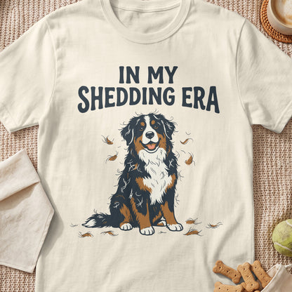 Bernese Mountain Dog sitting with shedding fur and text "In My Shedding Era."