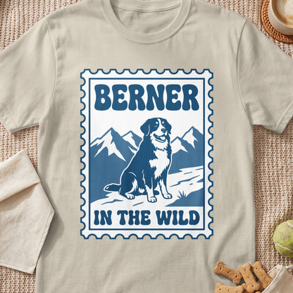 Berner dog illustration in a stamp with mountains and text "BERNER IN THE WILD".