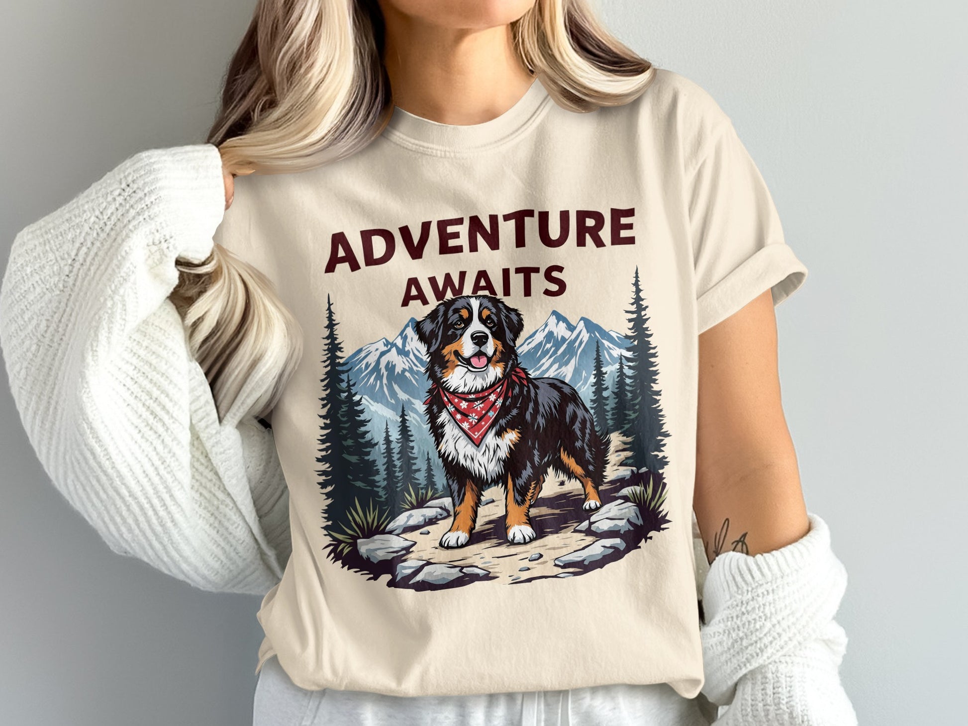 Cream t-shirt with "ADVENTURE AWAITS" text and a Bernese Mountain Dog.