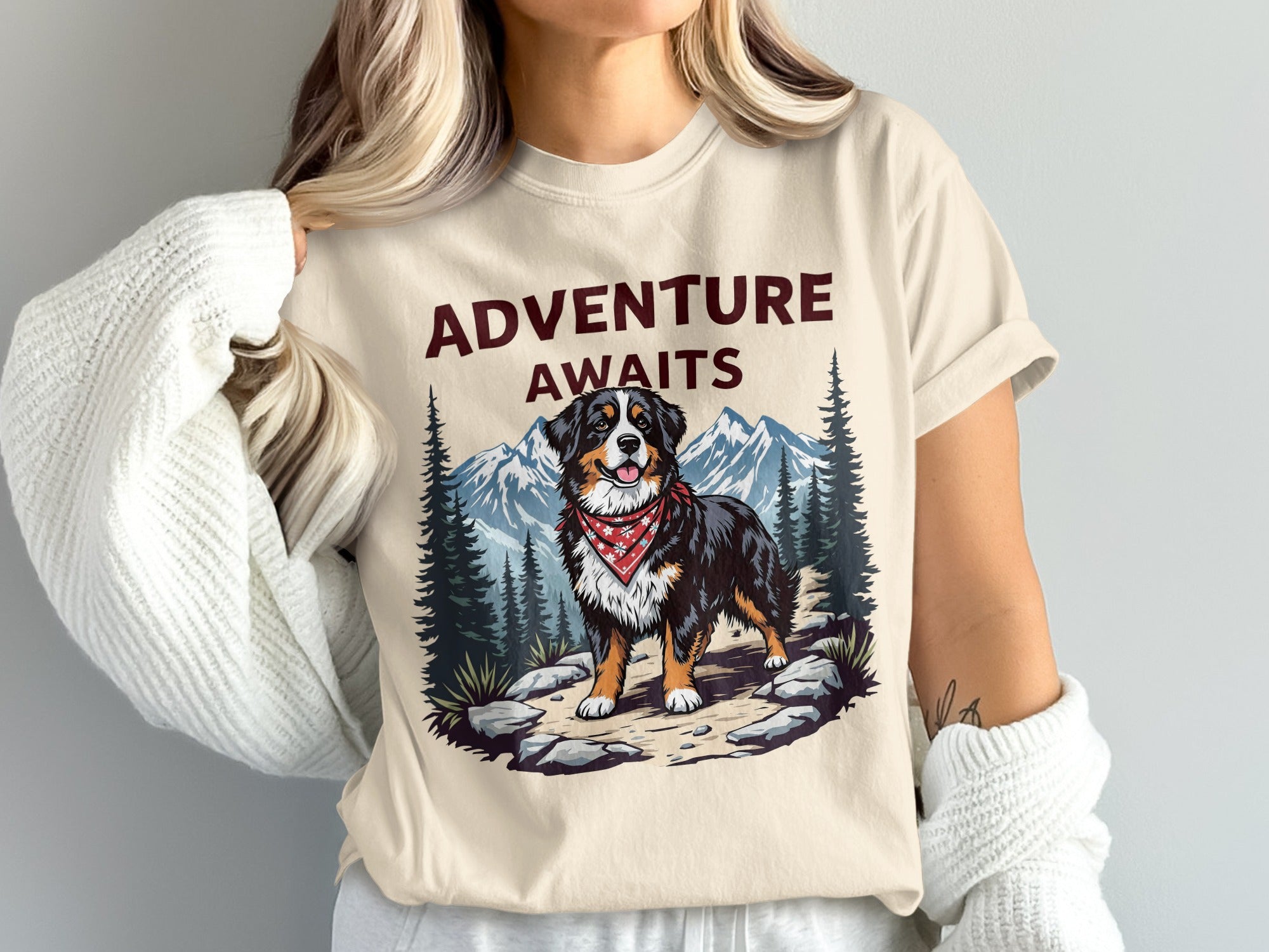 Cream t-shirt with "ADVENTURE AWAITS" text and a Bernese Mountain Dog.