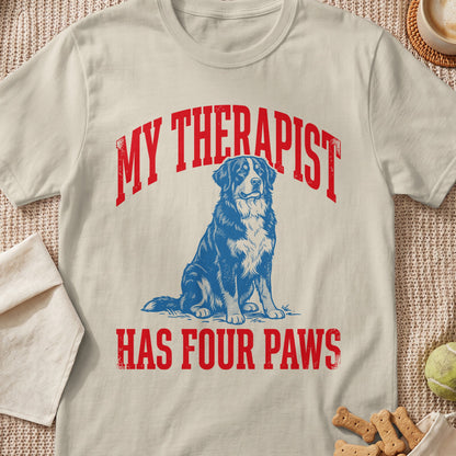 T-shirt with "My Therapist Has Four Paws" text and blue dog graphic.