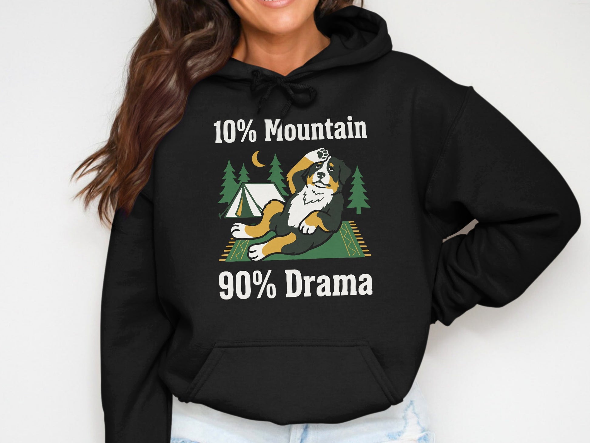 Black hoodie with graphic of a dog, tent, trees, moon, and text "10% Mountain 90% Drama."