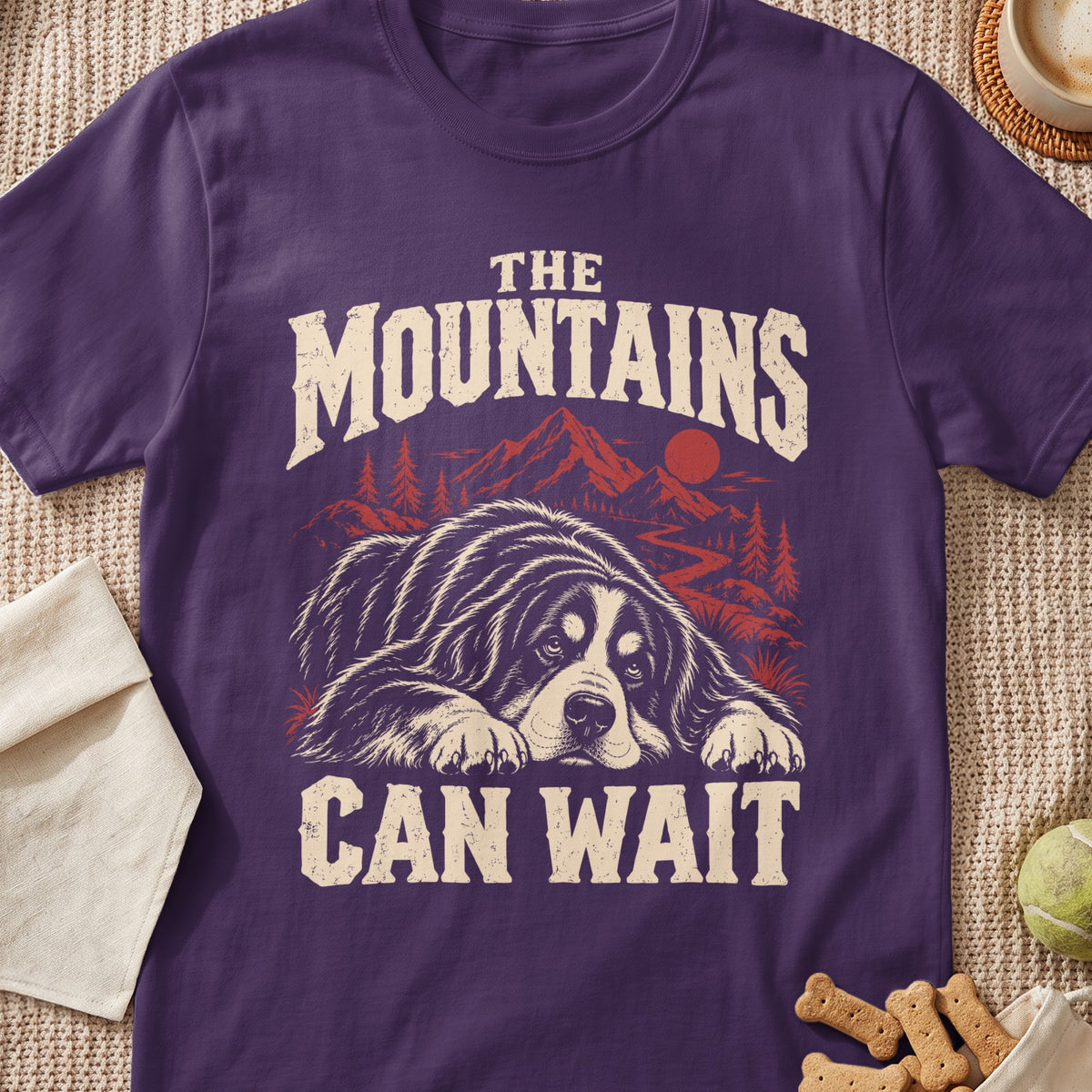 Purple t-shirt with dog, mountains, and text: "The Mountains Can Wait".