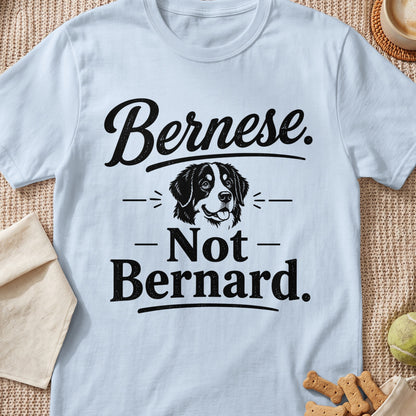 Bernese. Not Bernard. graphic with dog illustration on light blue t-shirt.