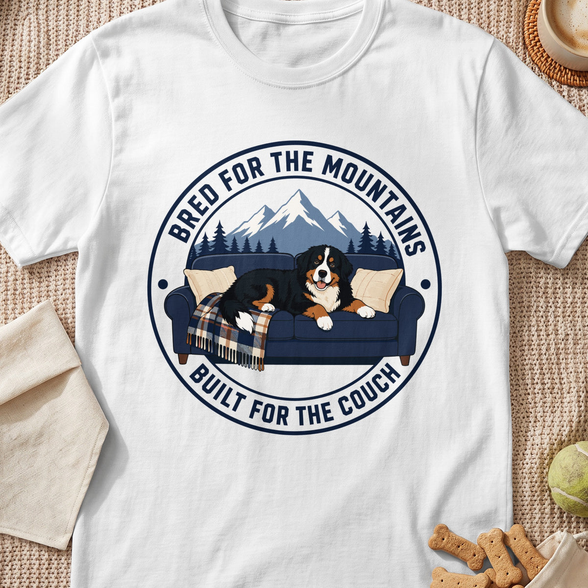 Bernese Mountain Dog on couch with text "Bred for the Mountains, Built for the Couch".