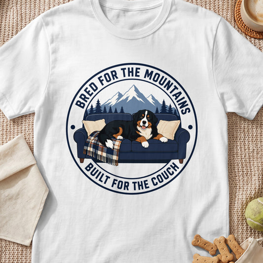Bernese Mountain Dog on couch with text "Bred for the Mountains, Built for the Couch".