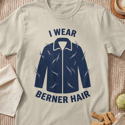 Cream t-shirt with navy graphic of a jacket covered in hair, text says "I WEAR BERNER HAIR".